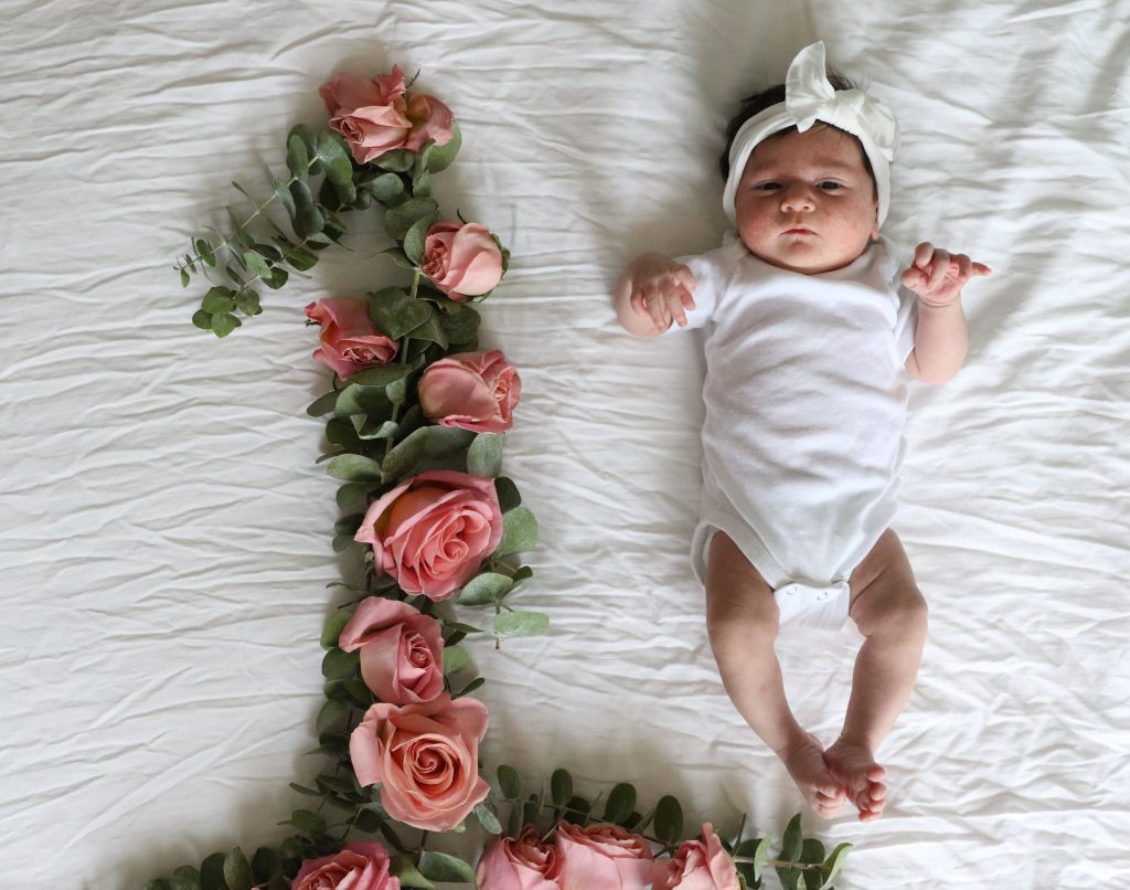 Pink Roses With One Year Old Baby