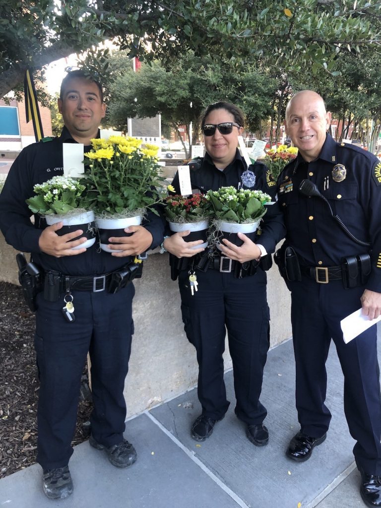 Dallas Police force passing out free flowers