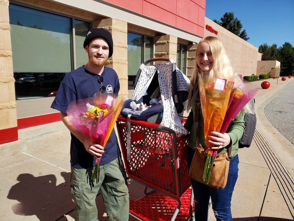 Young couple receive free flowers