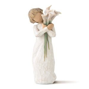 Shop for a figurine of a woman holding a bouquet of flowers.