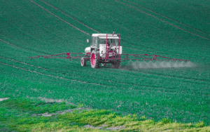 Moving vehicle spraying pesticides on the display