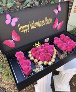 Happy valentine's day gift box with roses and butterflies.